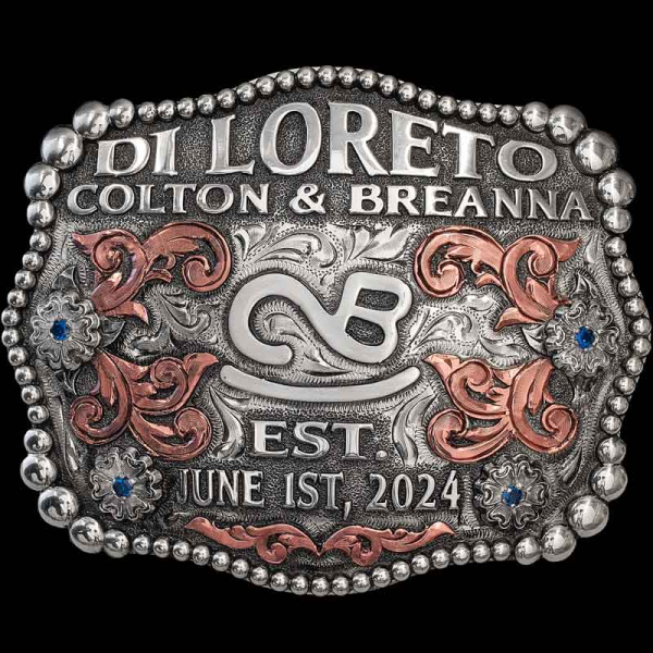 A Twist on our best-selling ""West Bottoms"" Belt Buckle! This Beautiful Custom Buckle is crafted on a hand engraved, German Silver base. Detailed with a beaded edge, German Silver lettering, flowers and Copper scrolls. 

Customize i
